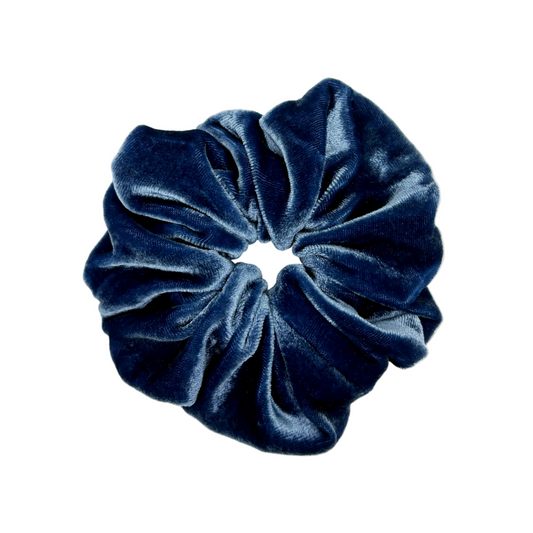 Blue velvet scrunchie on a white background