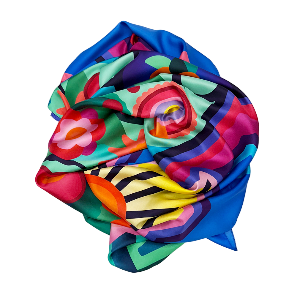 Colorful scarf with floral and abstract patterns on a white background