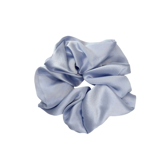 Light blue satin scrunchie on a white background
