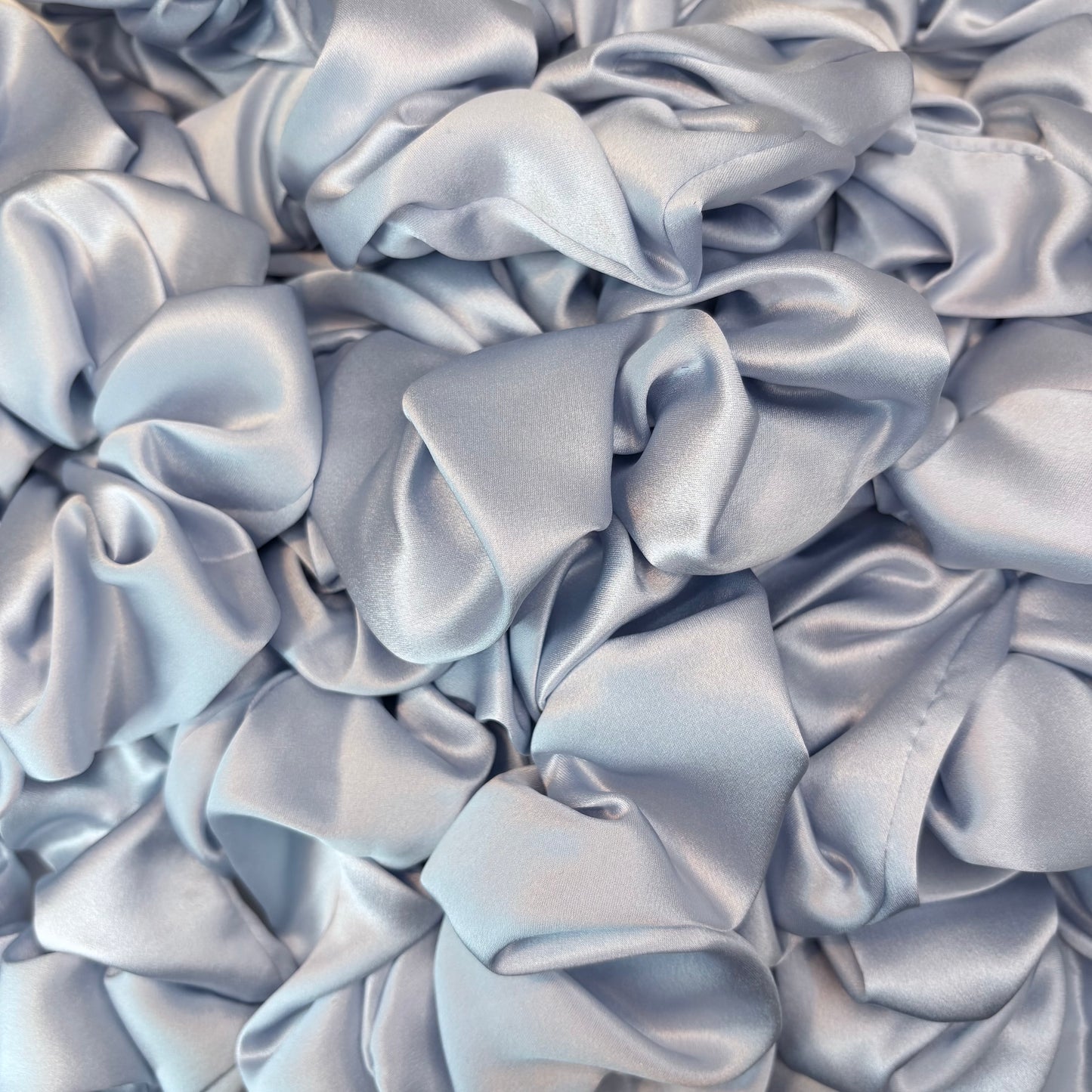 Close-up of crumpled light blue fabric
