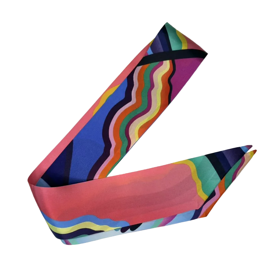 Colorful geometric-patterned silk ribbon on a white background