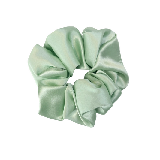 Light green satin scrunchie on a white background