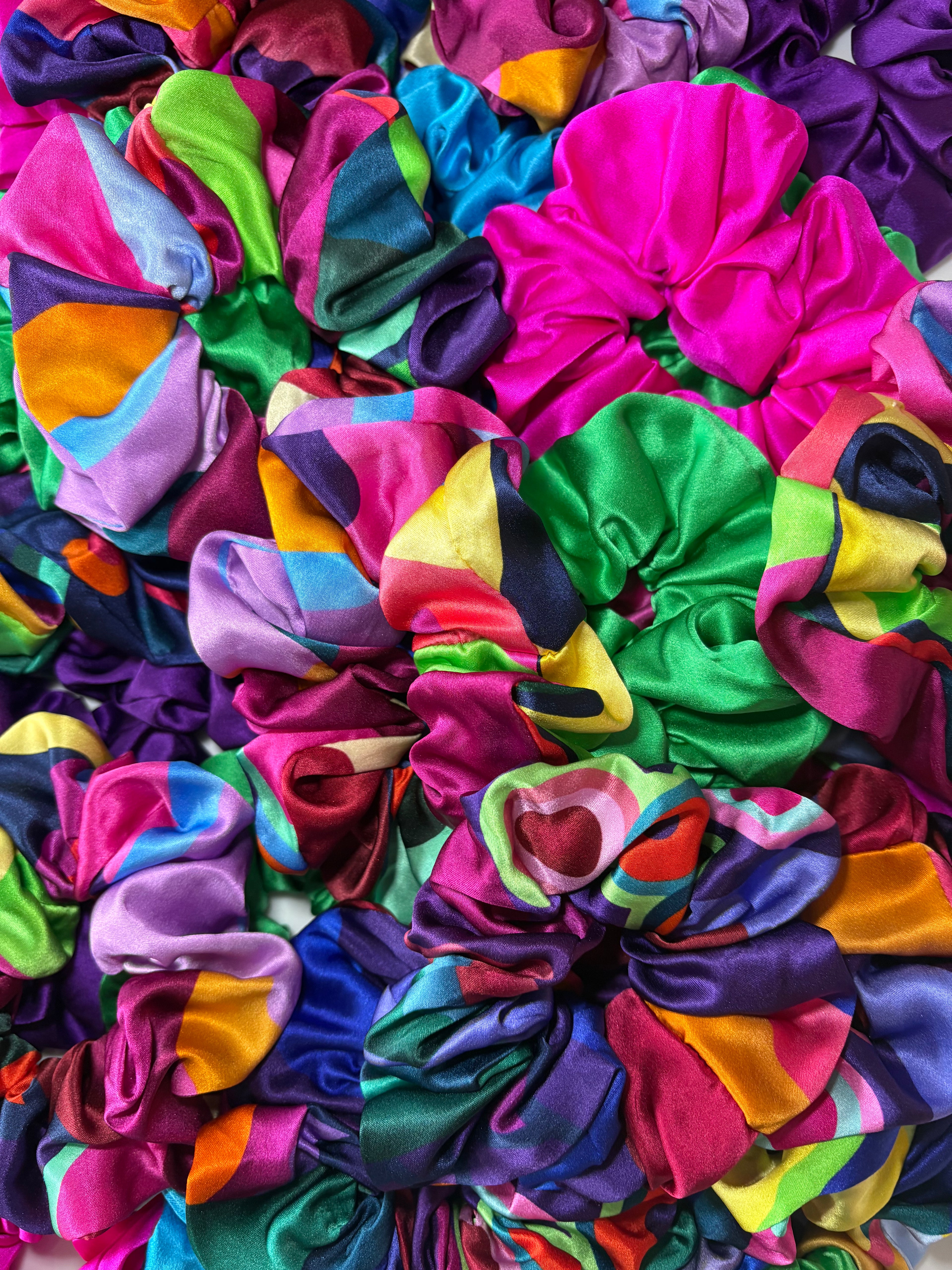 Multicolored scrunchies arranged in a pattern
