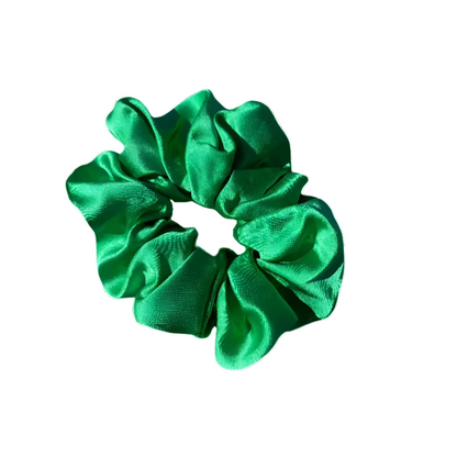 Green scrunchie on a white background