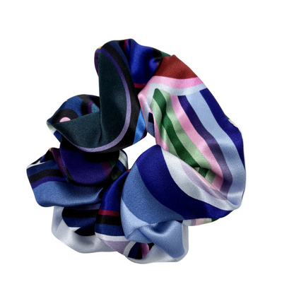 Multicolored striped scrunchies on a white background