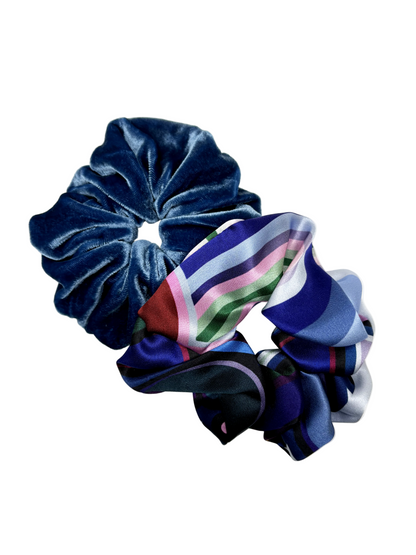 Two scrunchies, one blue and one striped, on a white background