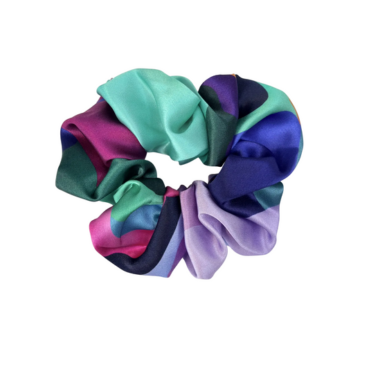 Multicolored satin scrunchie on a white background
